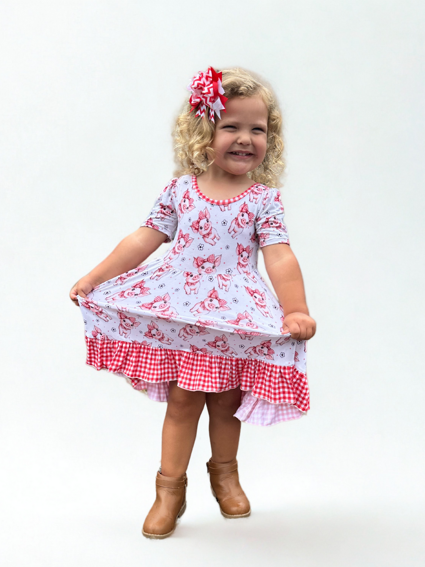 Bamboo twirl dress with pigs and bows and gingham red