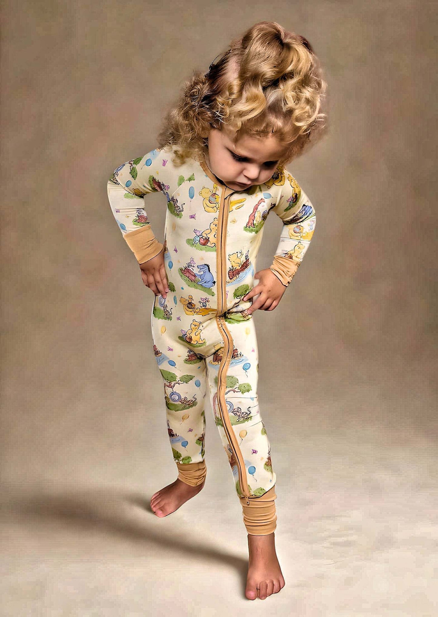 Woodland Friends Bamboo Romper on toddler, featuring luxury viscose bamboo and spandex, double sided zipper, and cute forest animal design.