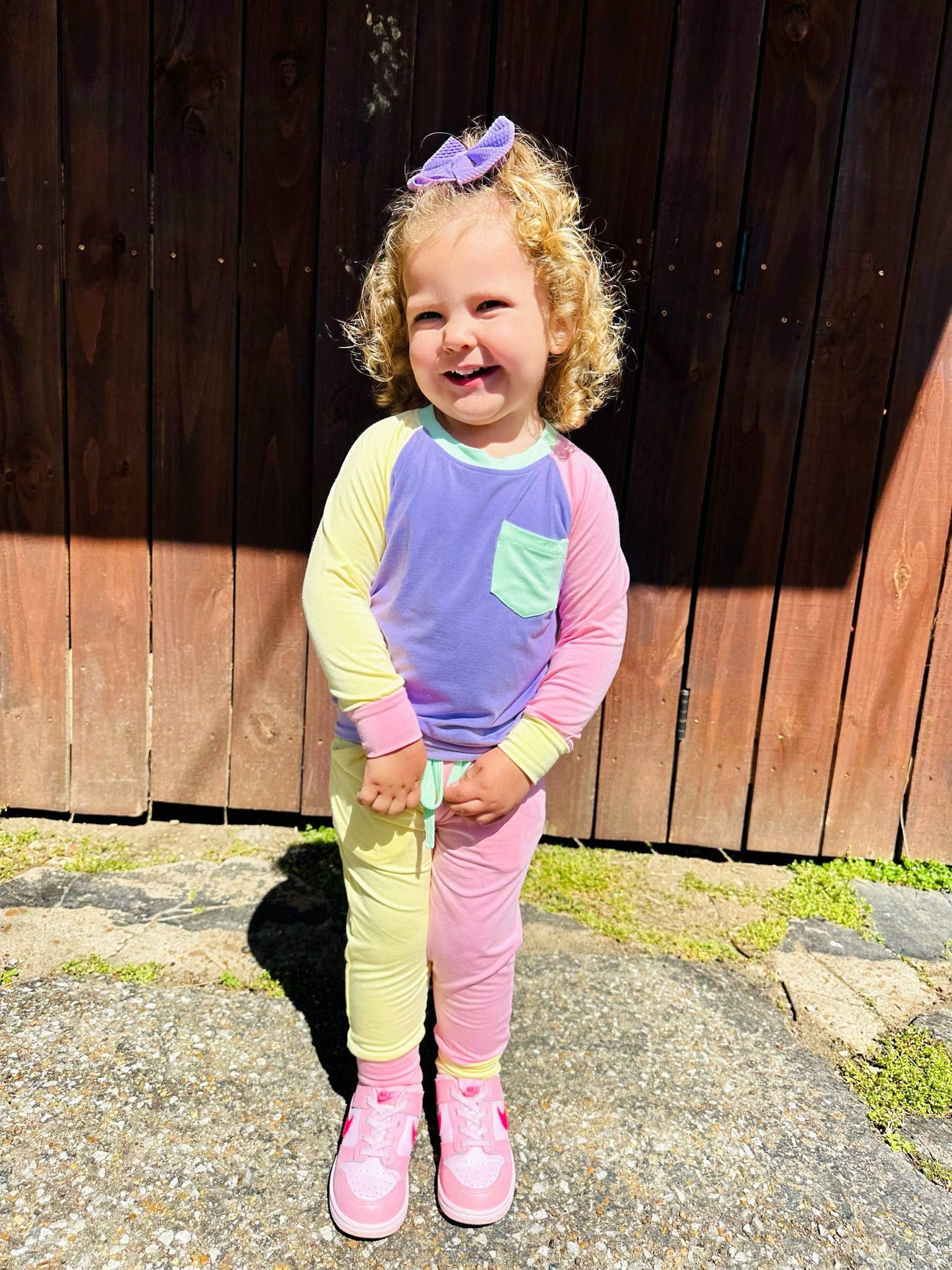 Color block purple and green bamboo jogger set with long sleeves and pockets, ideal for cooler temperatures.
