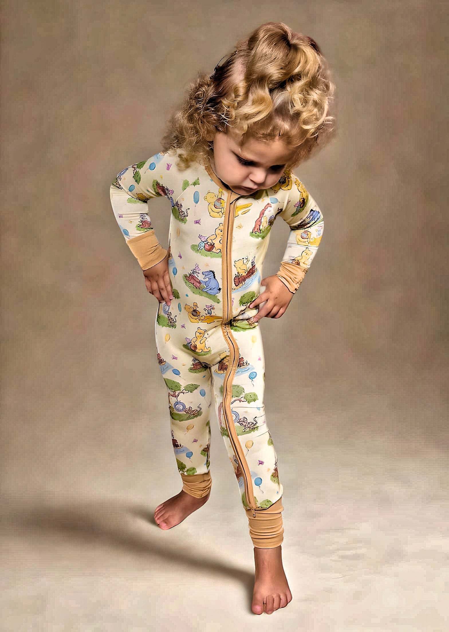Woodland Friends Bamboo Romper on toddler, featuring luxury viscose bamboo and spandex, double sided zipper, and cute forest animal design.