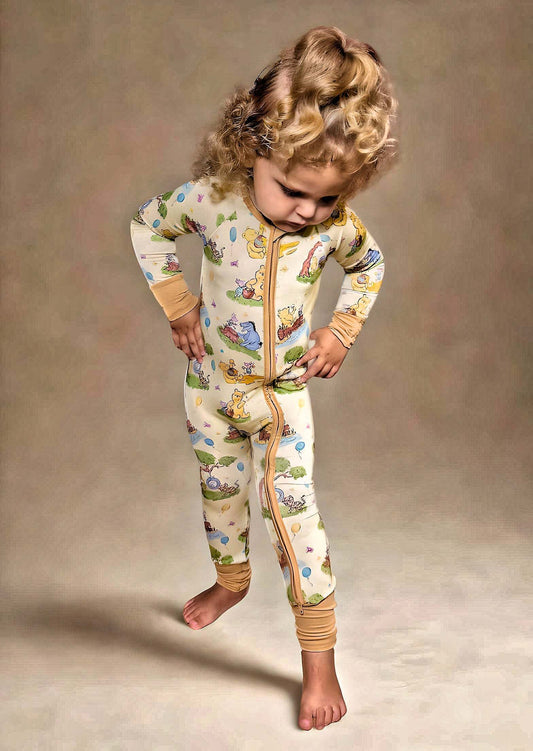 Woodland Friends Bamboo Romper on toddler, featuring luxury viscose bamboo and spandex, double sided zipper, and cute forest animal design.