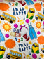 Colorful toddler blanket with school bus, sun, crayons, numbers, letters, and "I'm so happy" text design on Learning is Fun Bamboo Blanket
