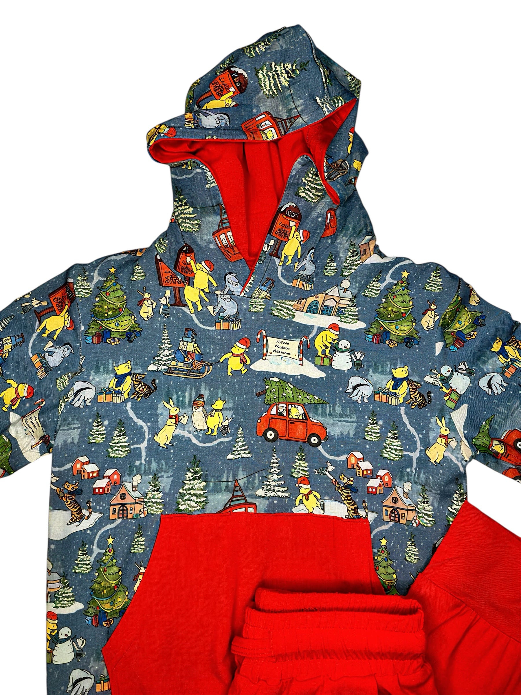 Hoodie with a colorful winter scene print on a blue background