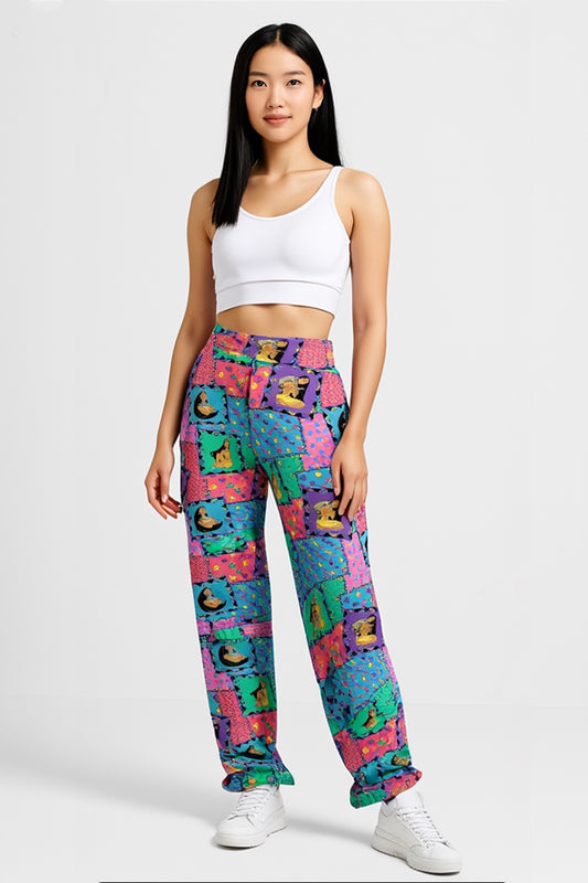 Woman wearing colorful patterned pants on a white background