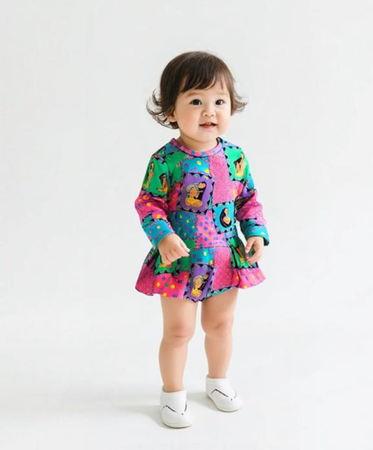 Child wearing a colorful patterned outfit on a white background