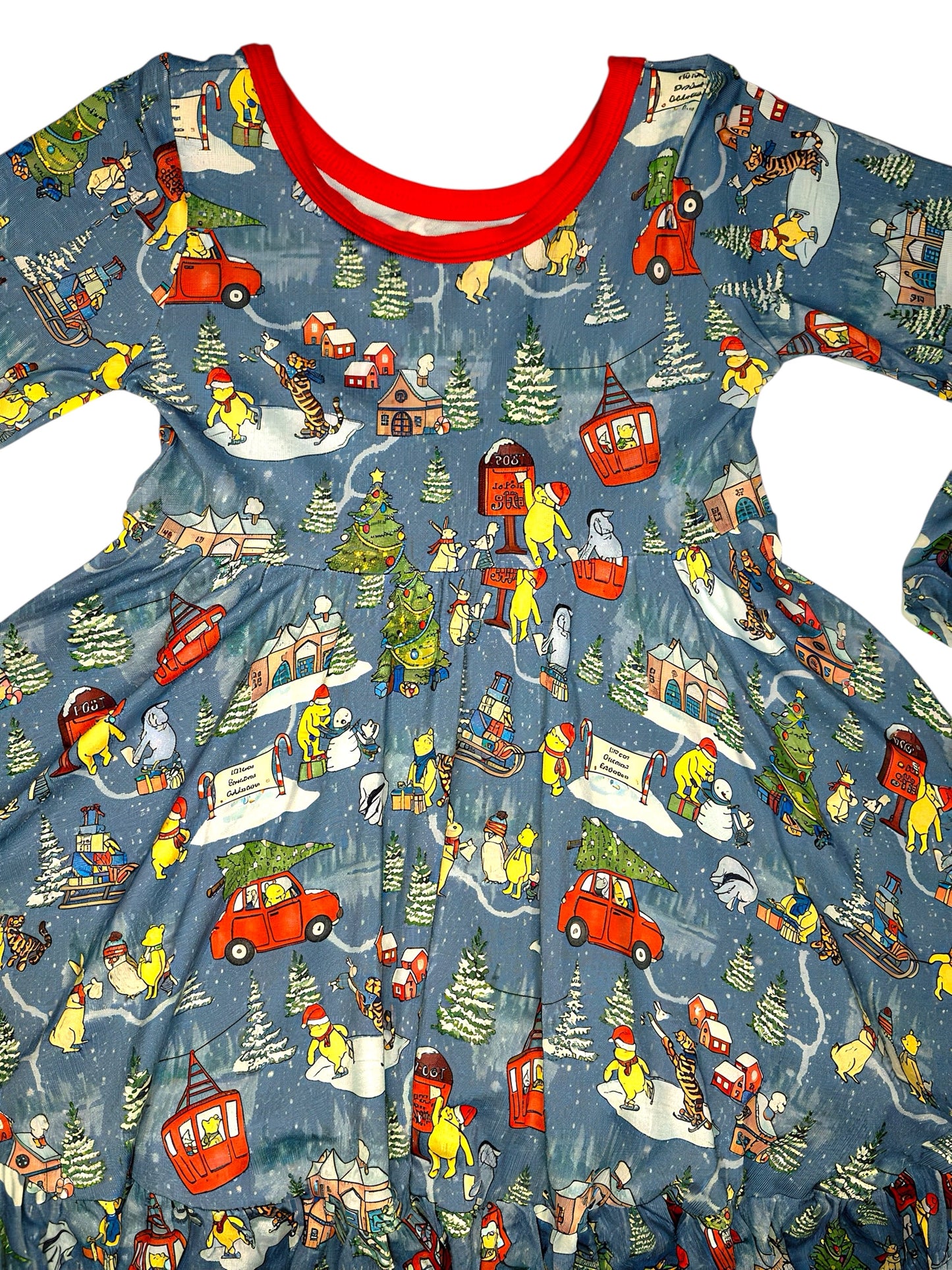Children's dress with winter scene print featuring snowmen, cars, and trees on a blue background.