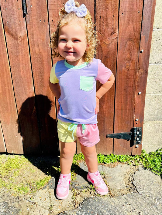 Color block purple and green bamboo pocket tee and short set for kids with drawstring shorts and pocket detail.