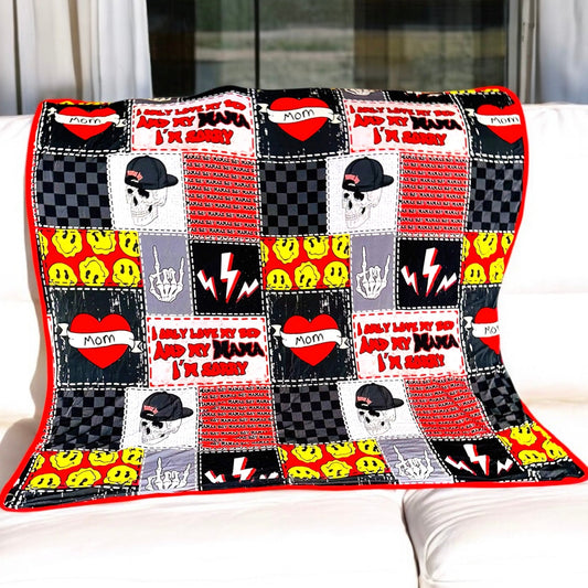Colorful patchwork design bamboo blanket on a sofa, featuring hearts and playful icons.