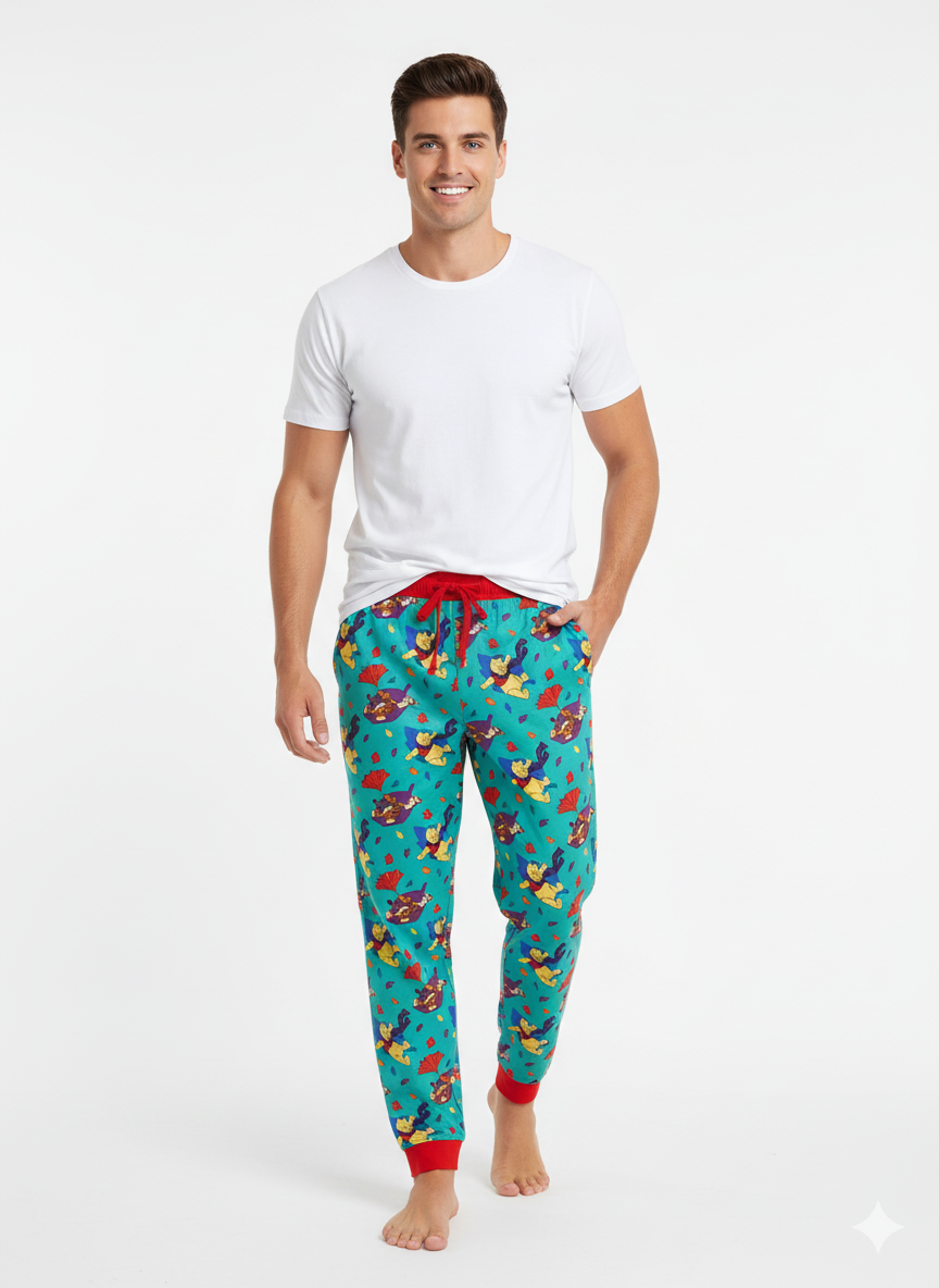 Man wearing a white t-shirt and colorful pajama pants on a white background